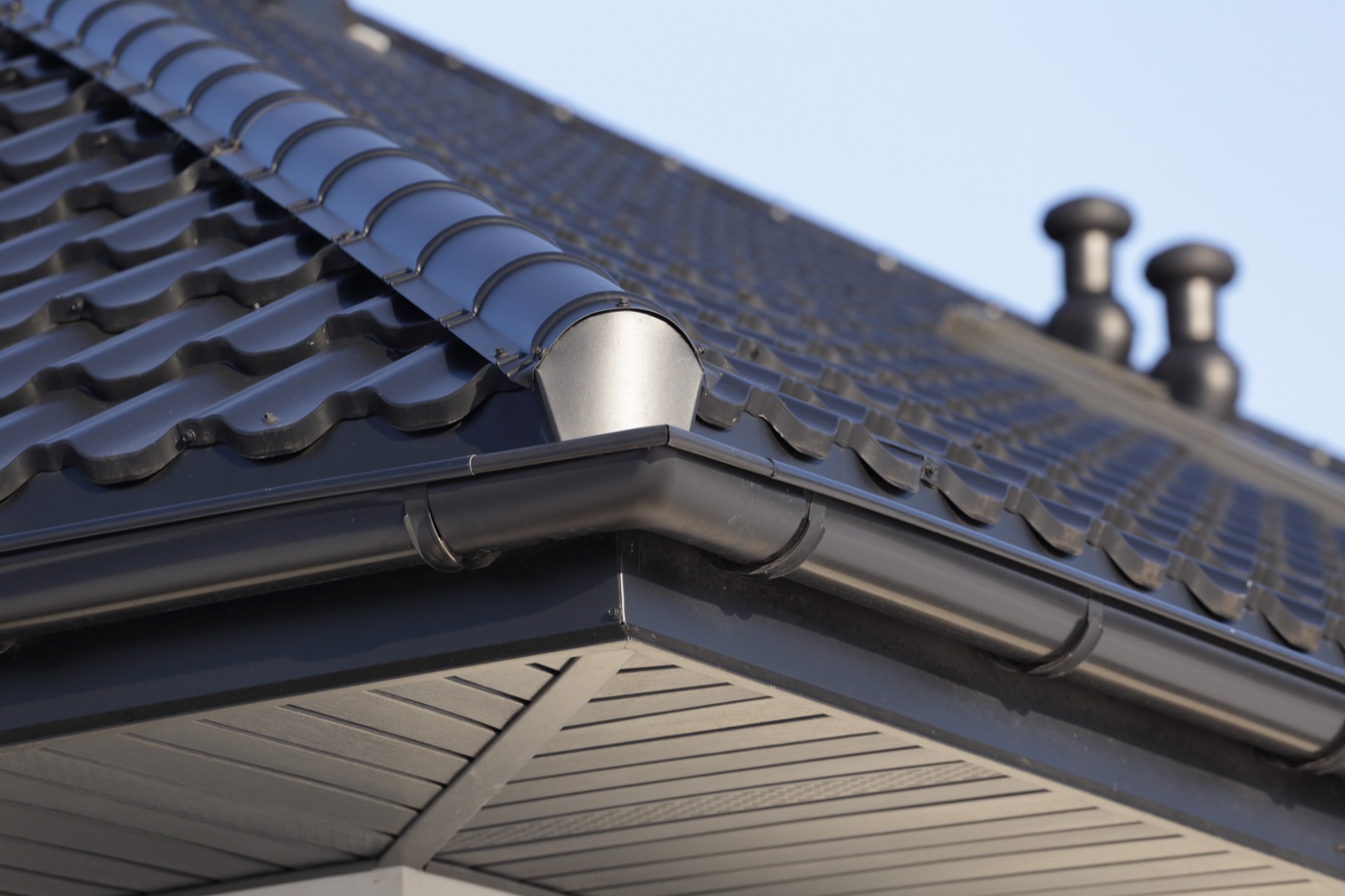 Roof tiles, gutter and downpipe detail